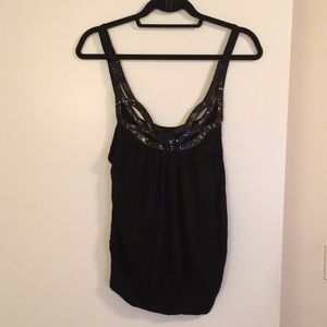 Black tank top with sequins detail. NWT. Size M